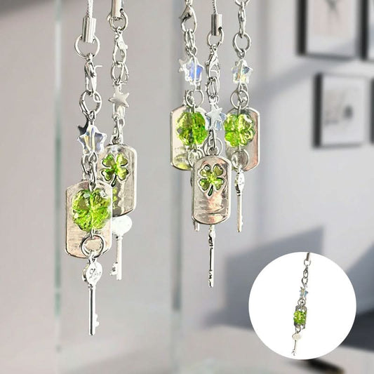 Geluks telefoonhanger met sleutel en vierbladig klavertje